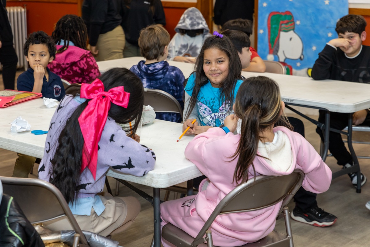 Students working together at tables in the After School Program